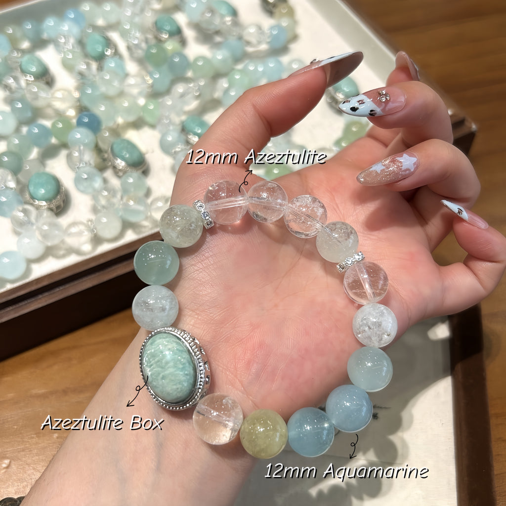 Close-up of Aquamarine, Amazonite, and Azeztulite gemstone beads showcasing natural blue and aqua colors