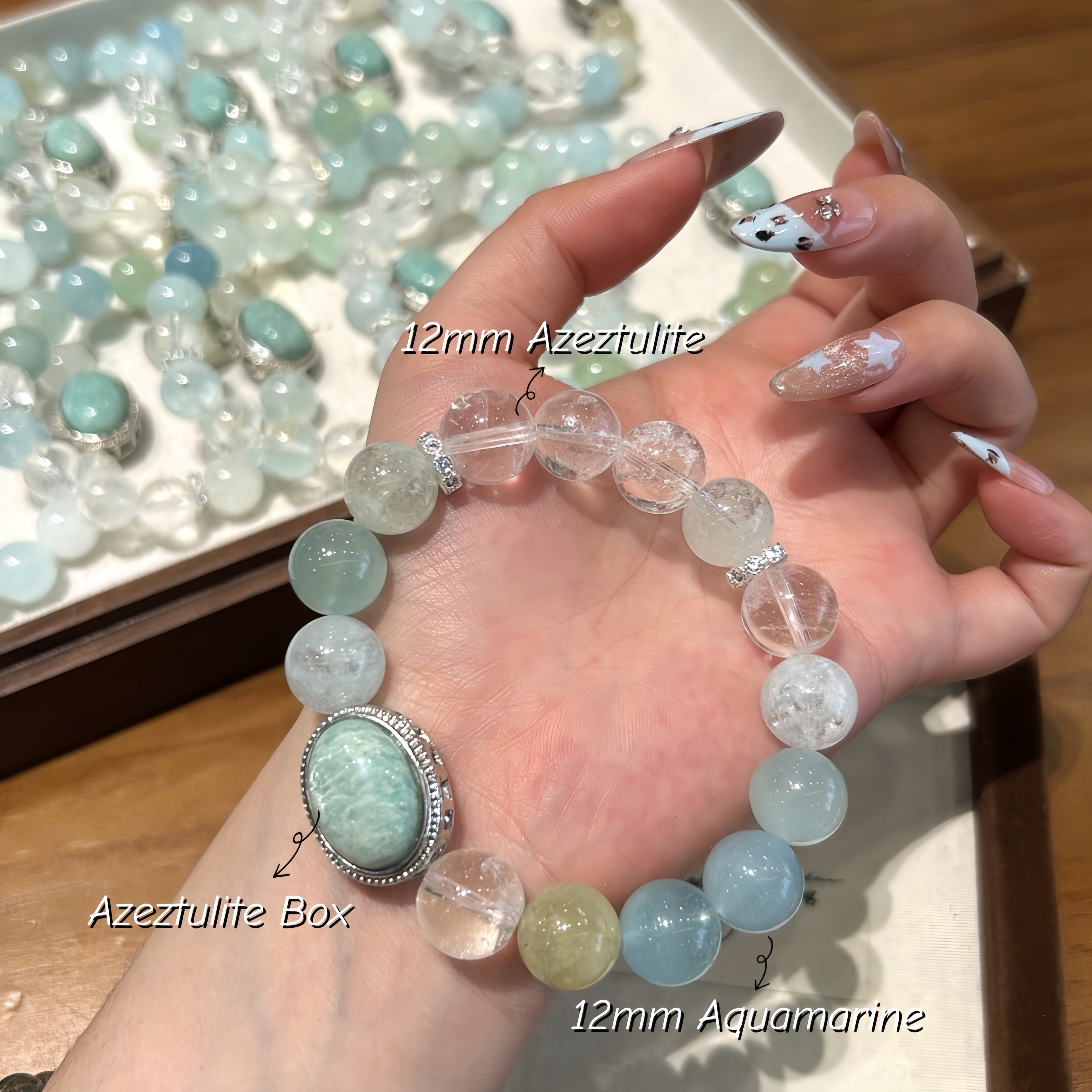 Close-up of Aquamarine, Amazonite, and Azeztulite gemstone beads showcasing natural blue and aqua colors