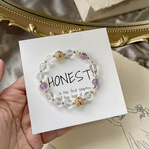 Celestial Purity faceted clear quartz bracelet featuring natural purple jade and a vintage copper orb charm for clarity and elegance.