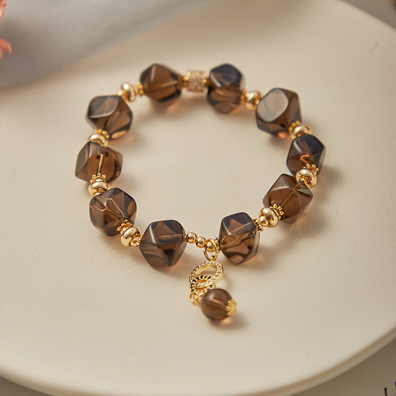 Close-up of faceted Smoky Quartz beads showcasing natural crystal clarity and subtle sparkle