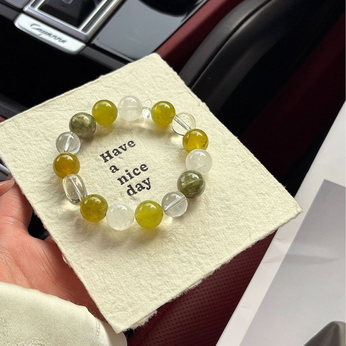 Close-up of Green Phantom Quartz and Clear Quartz beads showcasing natural gemstone details