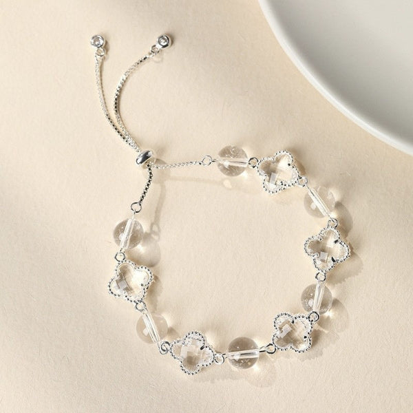 Joyceen Clear Quartz Clover Bracelet featuring natural clear quartz gemstones and four-leaf clover charms