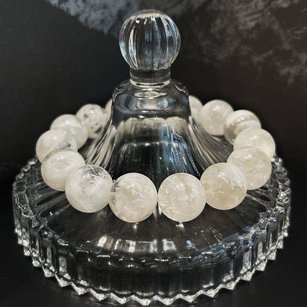 Winter-inspired Snow Phantom Quartz bracelet with frosted white tones and elegant crystal details